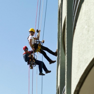Two painters doing hope access in a building