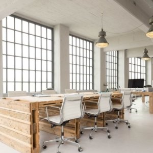White office space with desks made of pallets
